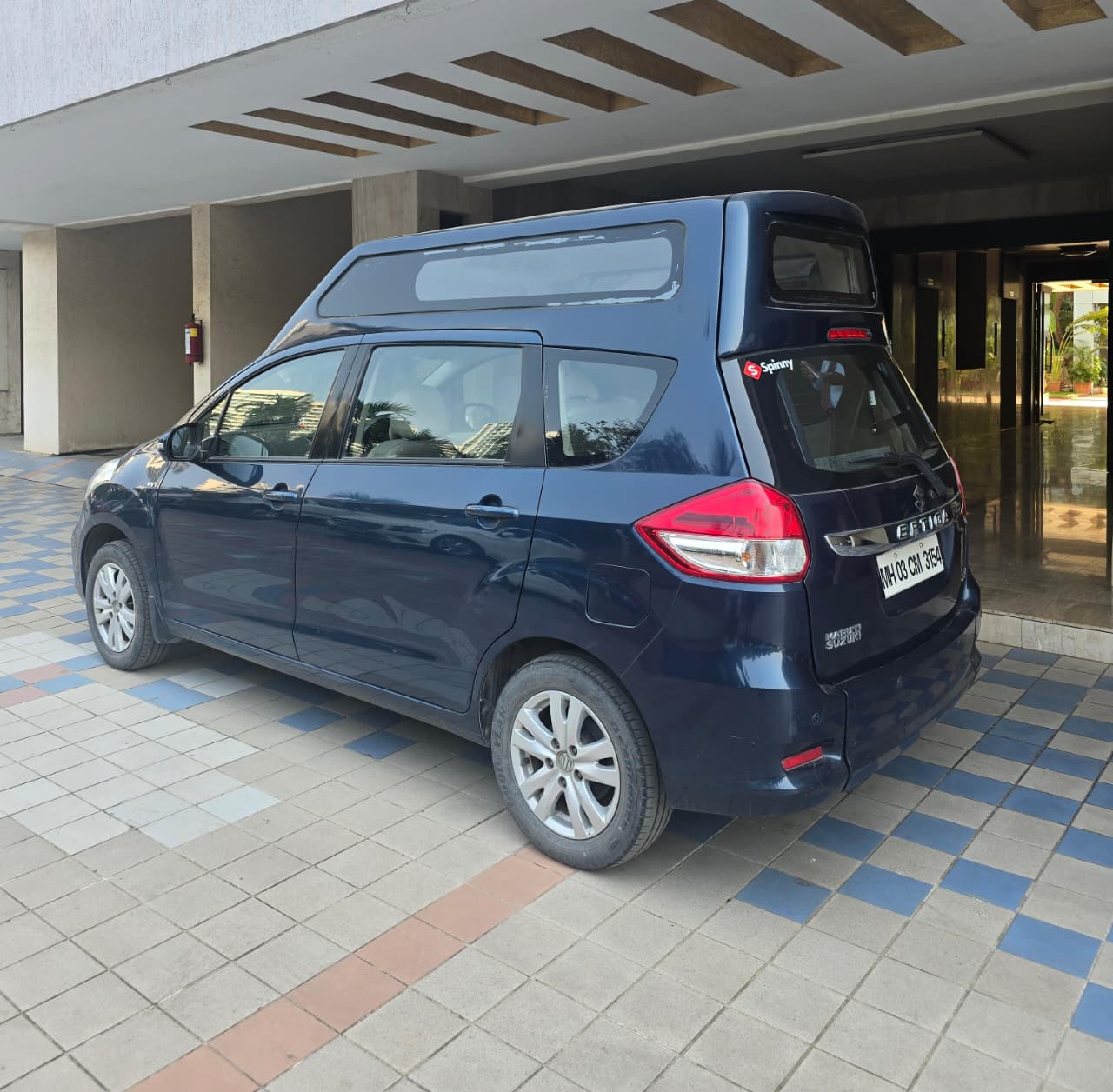 Blue Ertiga with raised roof extension